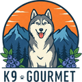 MY K9 Gourmet Logo in full color featuring a husky-like wolf dog, mountains, an orange sky with clouds and blueberries.